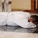 San Nicolas, May, CUB - August 28, 2020: A young seminarian prays at a religious celebration before being ordained a priest in the Archdiocese of Havana.  The mass is celebrated amid the outbreak of coronavirus cases in Havana.